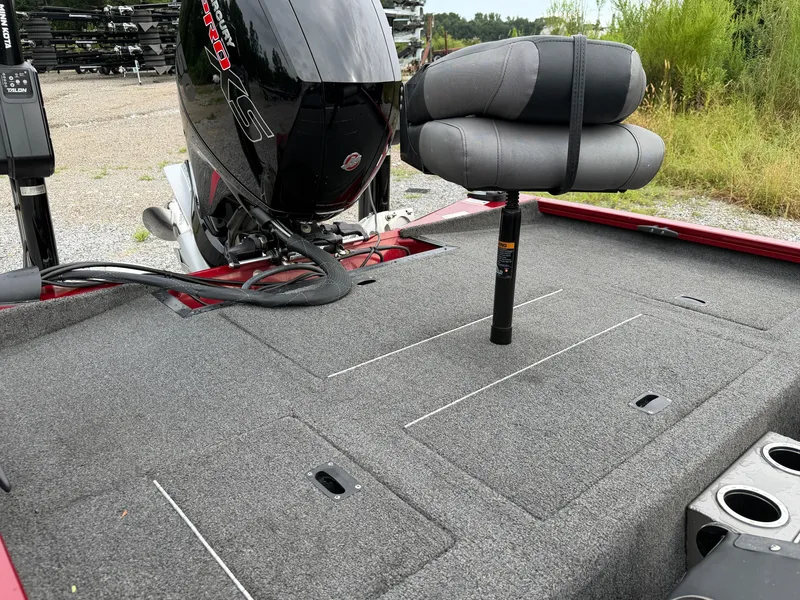 Slide: The Image of The image shows the rear of a 2022 Crestliner CXF 189 boat with a gray seat and outboard motor. - 17