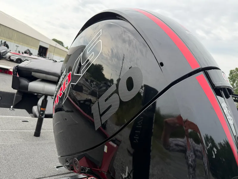 Slide: The Image of Close-up of an outboard motor labeled "150" with red accents, mounted on a boat. - 22