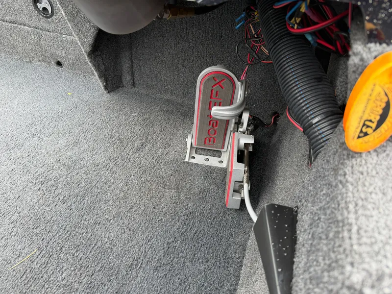 Slide: The Image of A boat pedal labeled "Boat X" is mounted on a gray carpeted floor. Wires are visible. - 18