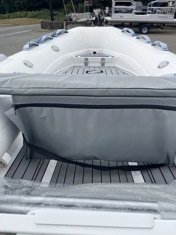 Slide: The Image of A Zodiac Nomad Rib Alu 2.7 boat with a gray seat and spacious interior. - 7