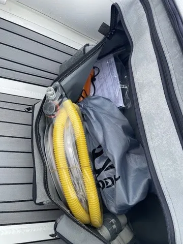 Slide: The Image of A bag with a yellow hose and accessories on a boat. - 17