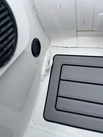 Slide: The Image of Close-up of a Zodiac Nomad Rib Alu 2.7 interior with a gray floor mat. - 14