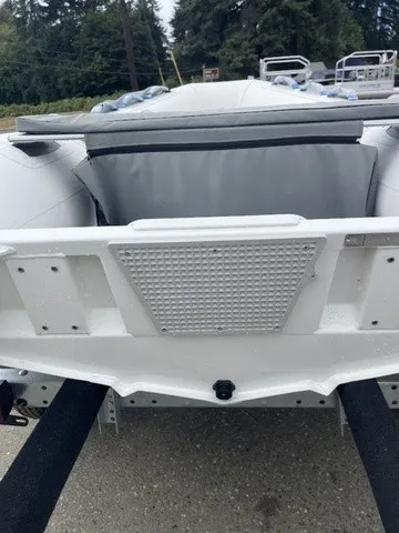 Slide: The Image of The image shows the stern of a 2027 Zodiac Nomad Rib Alu 2.7 boat. - 6