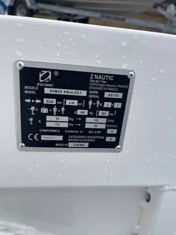 Slide: The Image of A nameplate on a Zodiac boat displays model information and technical specifications. - 2