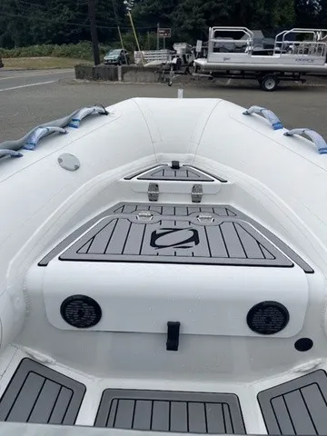 Slide: The Image of Zodiac Nomad Rib Alu 2.7 from 2027 with gray decking and white sides. - 8