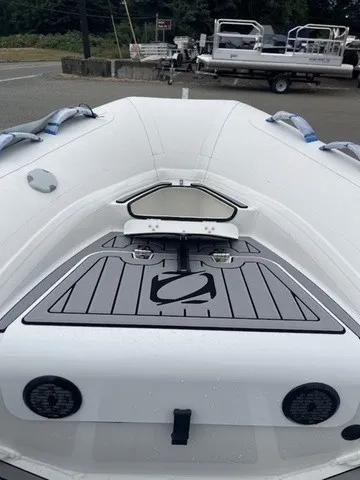 Slide: The Image of The image shows the bow of a Zodiac Nomad Rib Alu 2.7 boat with gray detailing. - 9