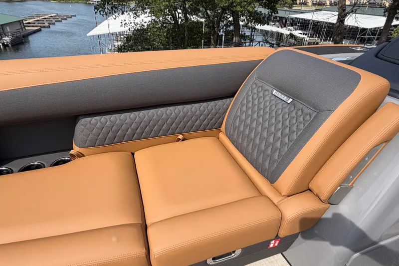 Slide: The Image of Luxurious seating on 2027 Harris Sunliner 250 boat, featuring tan and gray upholstery. - 24