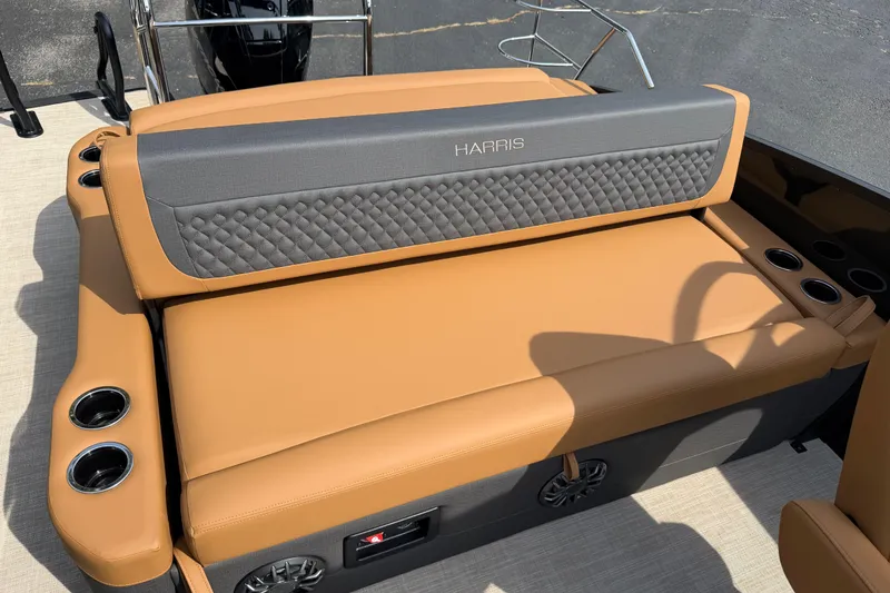 Slide: The Image of Luxurious seating on 2027 Harris Sunliner 250 boat with tan upholstery and cup holders. - 15
