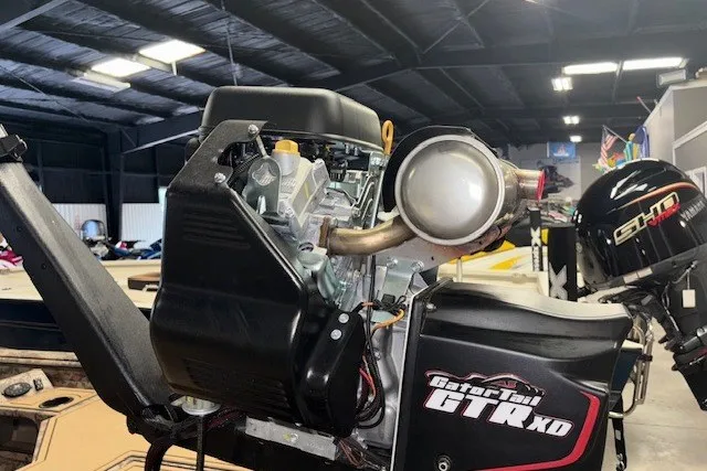 Slide: The Image of Outboard motor in a workshop, featuring Gator Tail GTR XD and Xpress Bayou 180, 2026 model. - 6