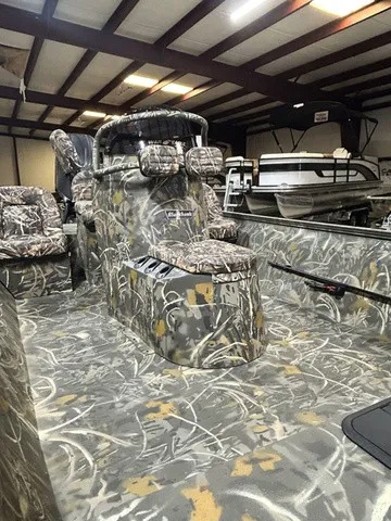Slide: The Image of The image shows a 2027 War Eagle 2170 Blackhawk boat with a camouflage interior. - 7