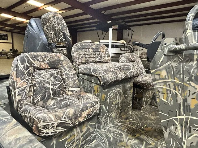 Slide: The Image of Interior of a War Eagle 2170 Blackhawk with camouflage-patterned seats. - 9