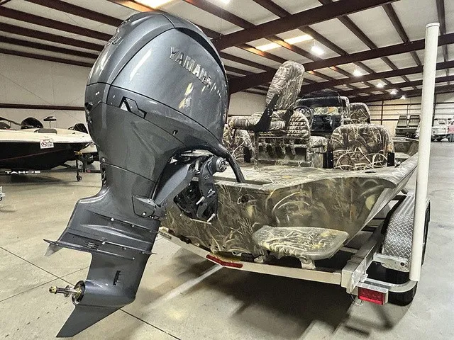Slide: The Image of 2027 War Eagle 2170 Blackhawk with a powerful outboard motor and camouflage interior. - 17