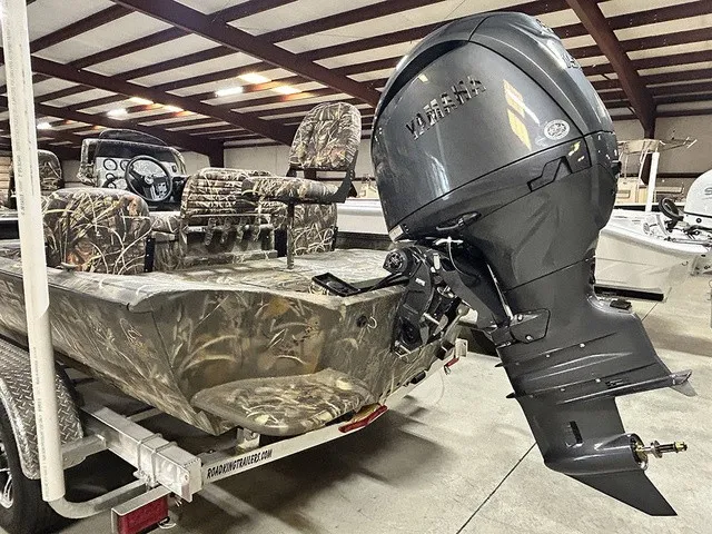 Slide: The Image of The image shows a 2027 War Eagle 2170 Blackhawk boat with a large outboard motor. - 16