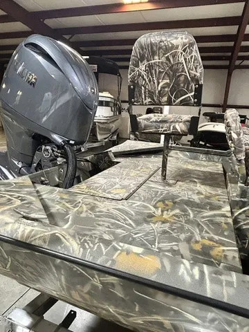 Slide: The Image of The image shows a War Eagle 2170 Blackhawk boat with camouflage pattern and an outboard motor. - 11