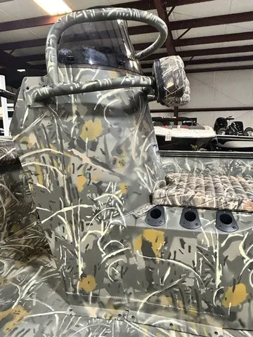 Slide: The Image of The image shows a boat with camouflage pattern and multiple rod holders. - 8