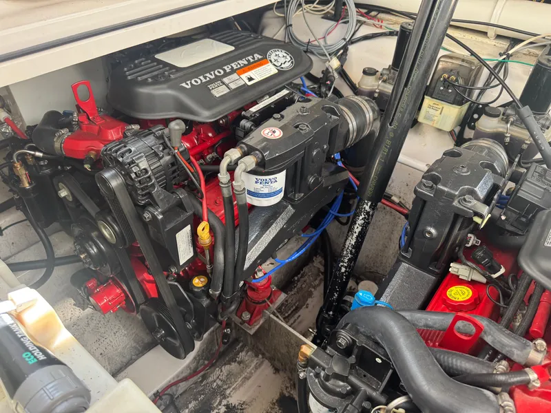 Slide: The Image of The engine compartment of a 2006 Four Winns 318 Vista with Volvo Penta engines. - 18