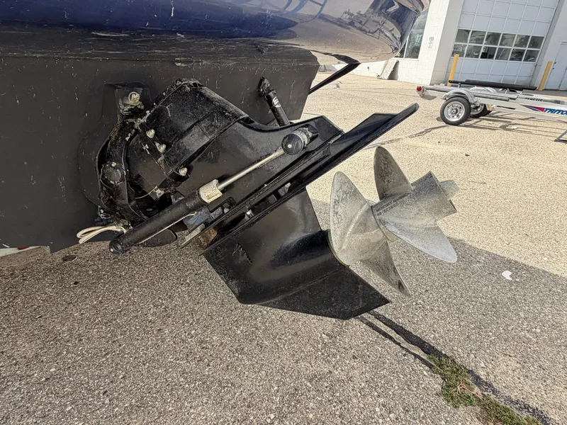 Slide: The Image of Close-up of a boat propeller and drive system on a parking lot. - 21