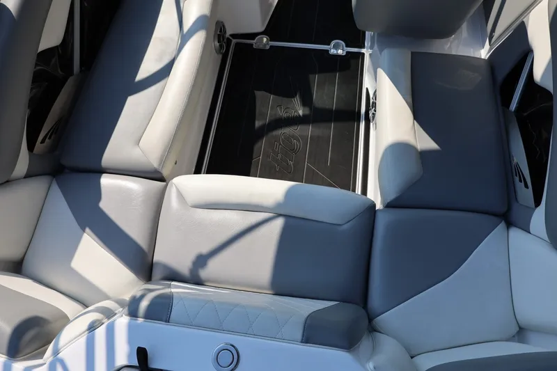 Slide: The Image of 2020 Tigé R20 boat interior with gray and white seating, showcasing modern design. - 26