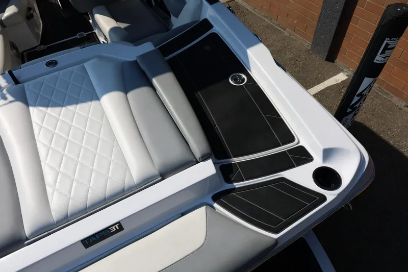 Slide: The Image of 2020 Tigé R20 boat interior with quilted seating and sleek black accents. - 17