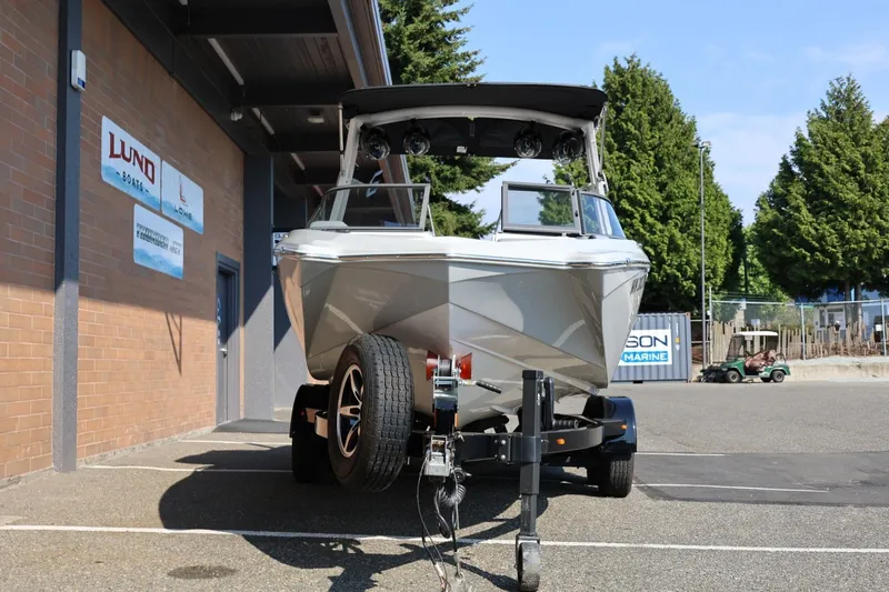 Slide: The Image of 2020 Tigé R20 boat on trailer outside marine dealership. - 13