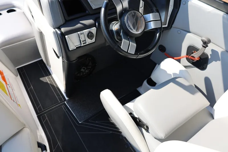 Slide: The Image of 2020 Tigé R20 boat interior with steering wheel and control panel. - 41