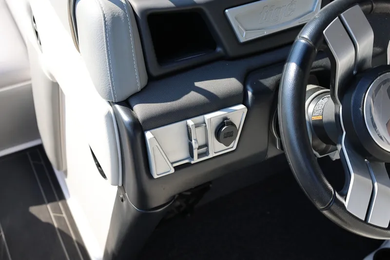 Slide: The Image of 2020 Tigé R20 boat dashboard with steering wheel and control panel. - 36