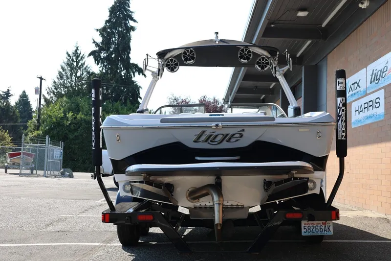 Slide: The Image of 2020 Tigé R20 boat on trailer, rear view, parked outside dealership. - 6