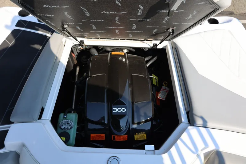 Slide: The Image of 2020 Tigé R20 boat engine compartment with open hatch, showcasing the 360 engine. - 23