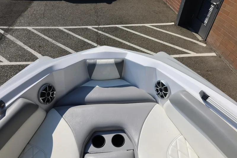 Slide: The Image of 2020 Tigé R20 boat interior with cushioned seating and cup holders. - 45