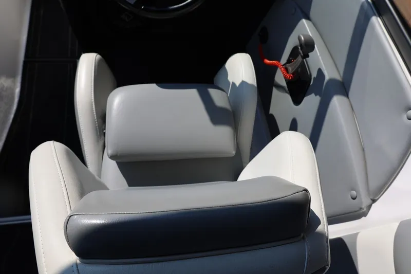 Slide: The Image of 2020 Tigé R20 boat interior with gray and white seating and control panel. - 34