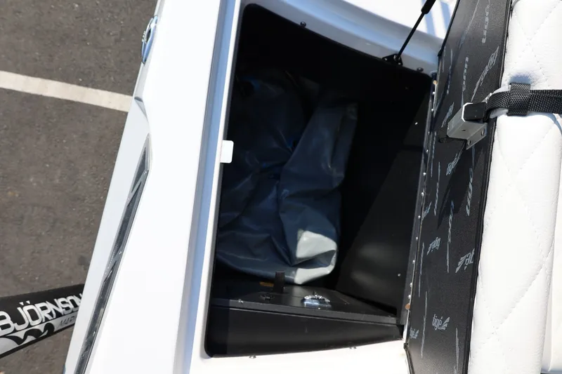 Slide: The Image of Open storage compartment in 2020 Tigé R20 boat with visible interior details. - 22