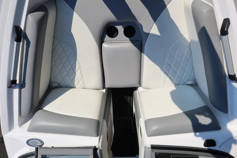 Slide: The Image of 2020 Tigé R20 boat interior with white and gray cushioned seating. - 46