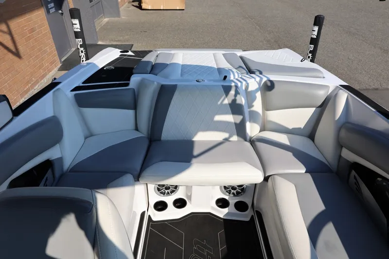 Slide: The Image of 2020 Tigé R20 boat interior with gray and white seating, featuring modern design and speakers. - 50