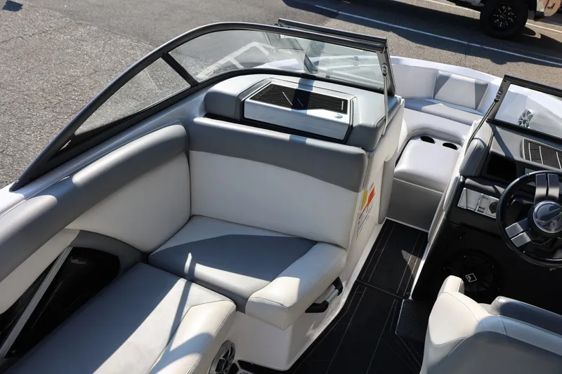 Slide: The Image of Interior of a 2020 Tigé R20 boat with sleek seating and modern dashboard. - 24