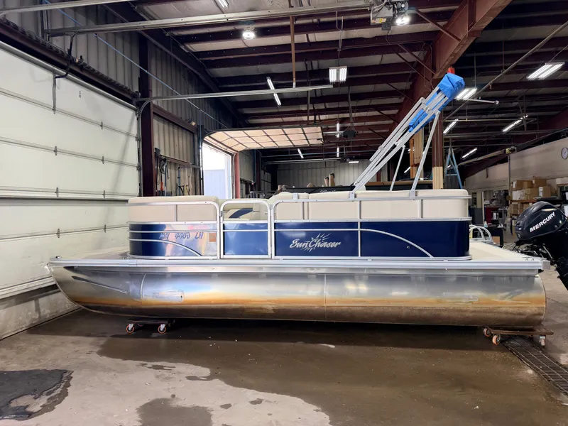 Slide: The Image of A 2015 SunChaser 8520 Classic Cruise pontoon boat in a warehouse. - 40