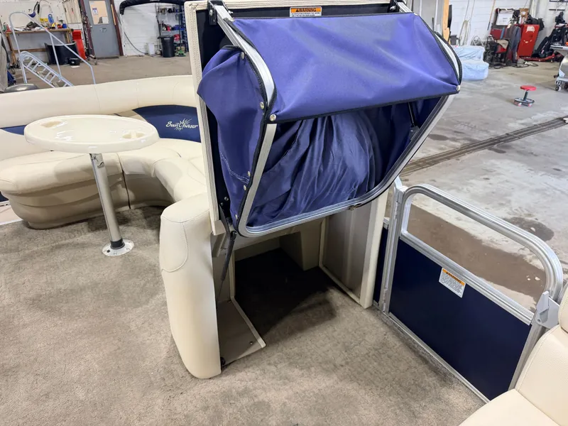 Slide: The Image of Interior of a SunChaser 8520 Classic Cruise with blue fabric elements and beige seating area. - 27