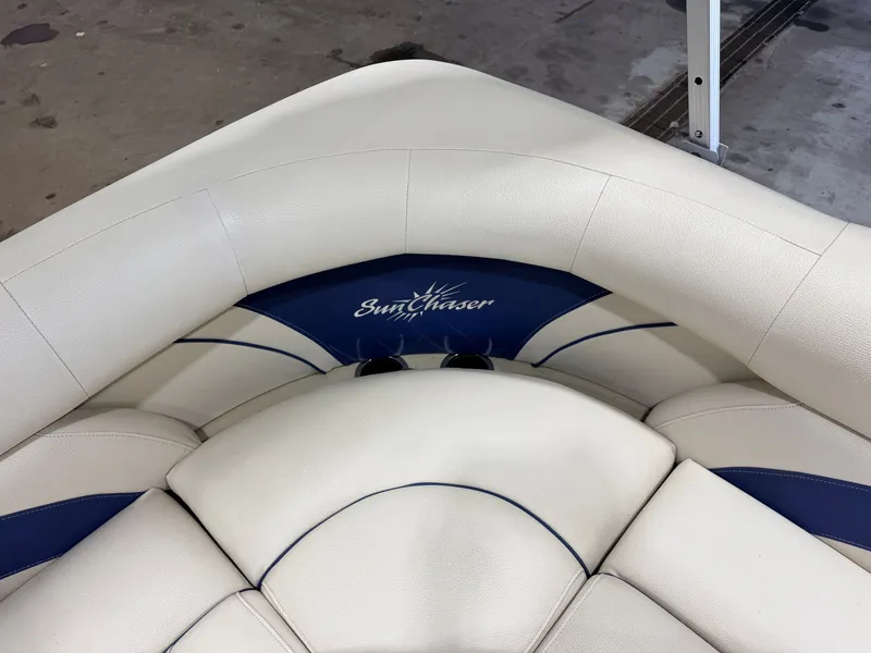 Slide: The Image of The image shows white and blue upholstery with the SunChaser logo on a boat. - 29