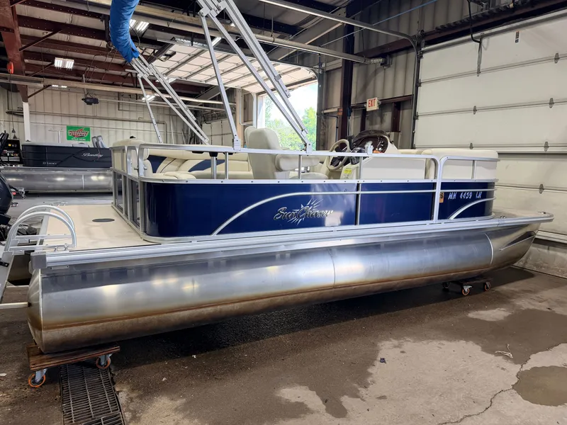 Slide: The Image of A 2015 SunChaser 8520 Classic Cruise pontoon boat in a garage. - 48