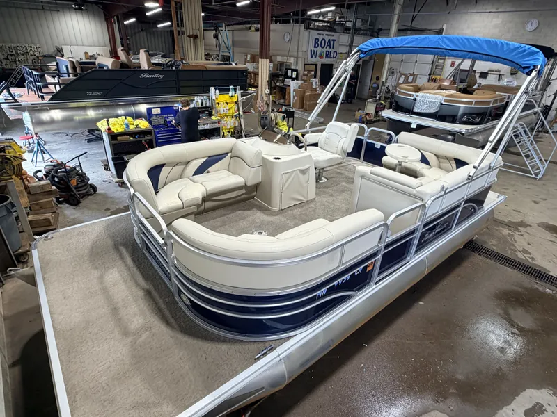 The Image of A 2015 SunChaser 8520 Classic Cruise pontoon boat with blue canopy. - 1