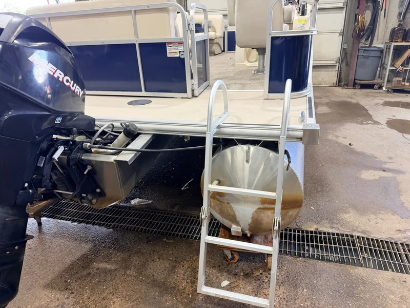 Slide: The Image of A 2015 SunChaser 8520 Classic Cruise with a 30HP Mercury 4Stroke EFI engine. A ladder leads into the water. - 33