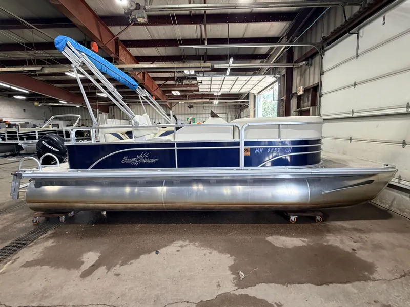 Slide: The Image of A 2015 SunChaser 8520 Classic Cruise pontoon boat in a warehouse. - 15