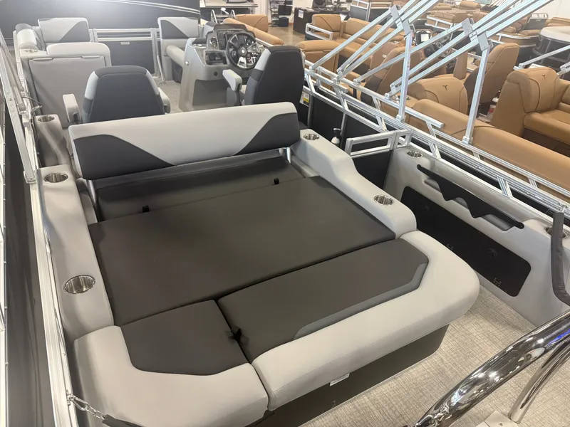 Slide: The Image of The image shows the interior of a modern boat with gray and black seating and a helm station. - 22