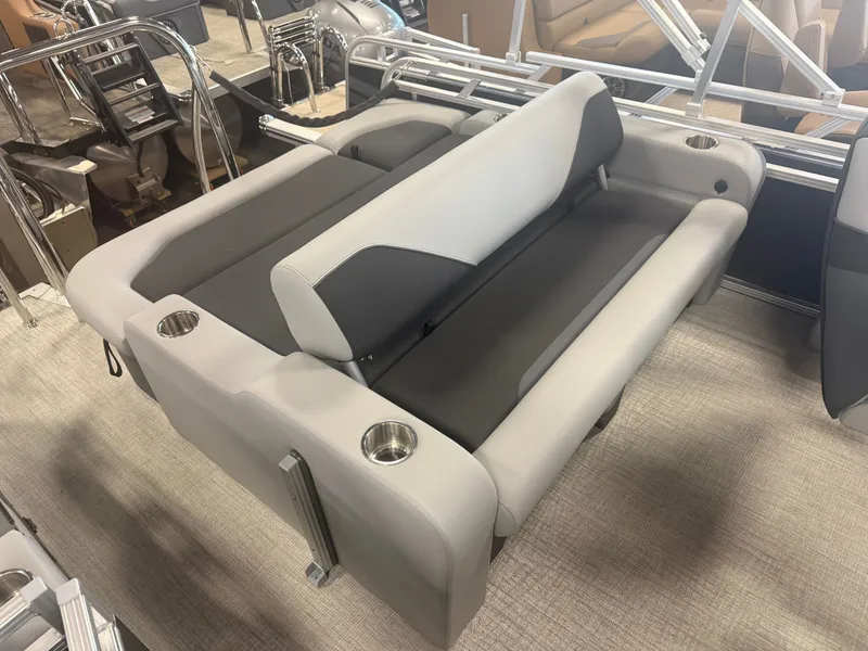 Slide: The Image of The image shows a luxurious boat seat with gray and white upholstery and built-in cup holders. - 4