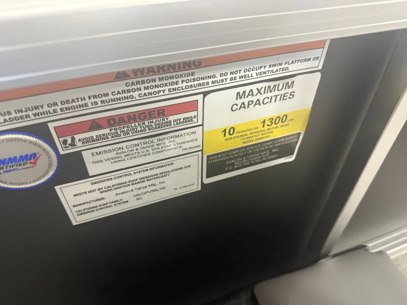 Slide: The Image of Warning labels and capacity information on a boat, including carbon monoxide danger and maximum occupancy. - 17