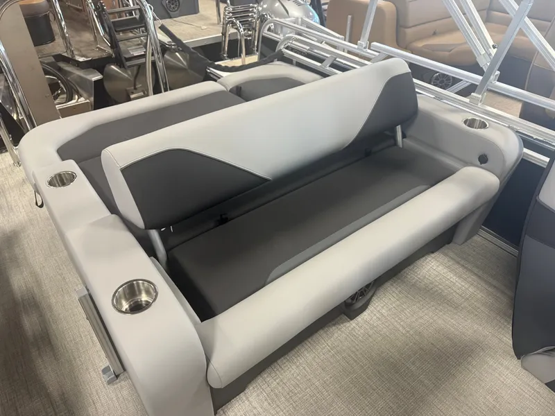 Slide: The Image of The 2026 Tahoe Sport VRB 2180 Swingback features gray and black upholstery with built-in cup holders. - 18