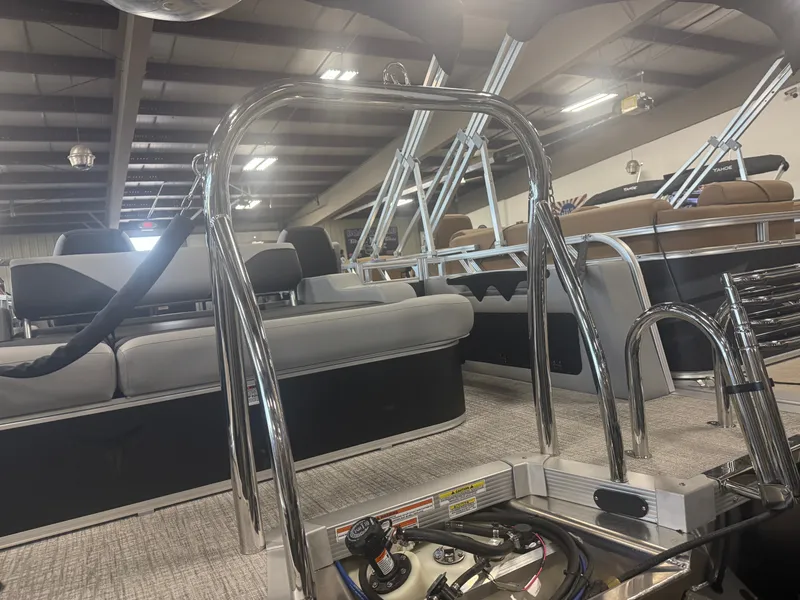 Slide: The Image of Interior view of a modern pontoon boat with sleek seating and shiny metal railings. - 35
