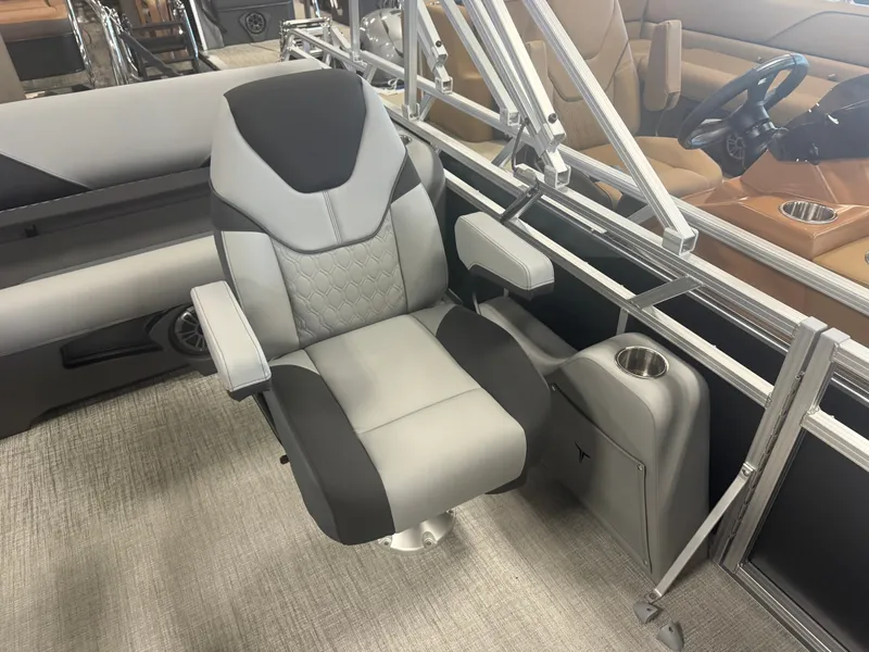 Slide: The Image of Modern boat seat with gray and black upholstery, surrounded by metal railings. - 10