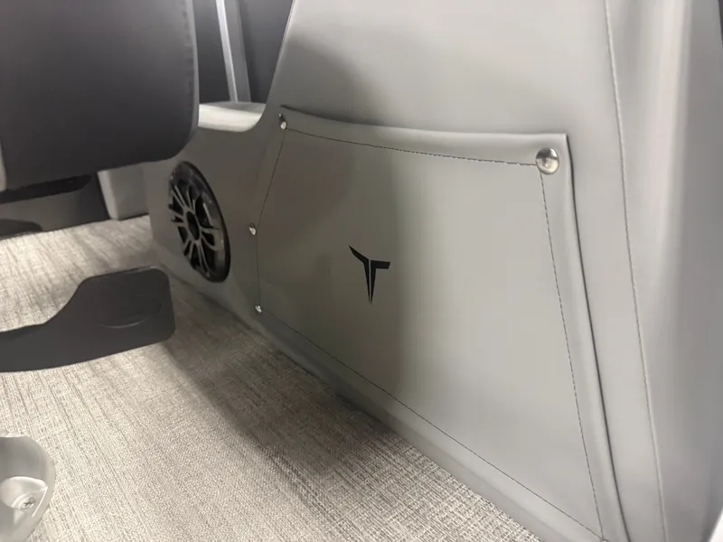 Slide: The Image of Close-up of a gray boat interior with speaker and logo. - 25
