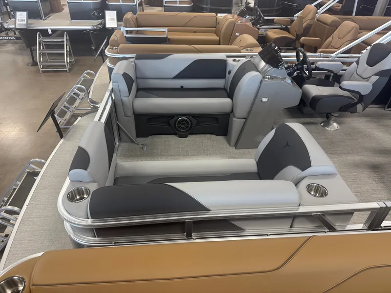 Slide: The Image of Interior of a modern pontoon boat with gray and beige seating and a helm station. - 2