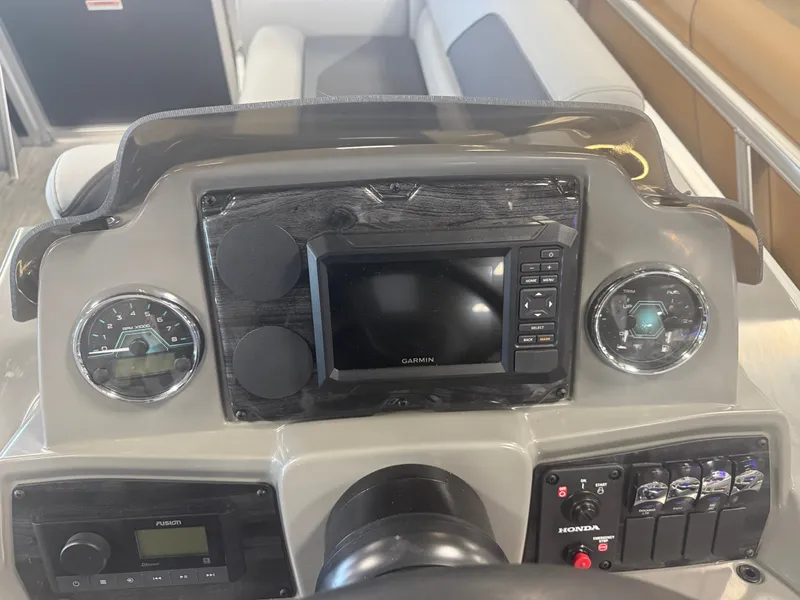 Slide: The Image of Boat dashboard with Garmin screen and controls. - 15